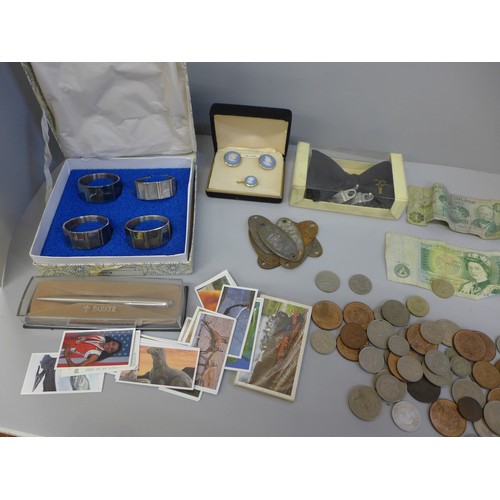 607 - A box of coins and notes, train plaques, etc.