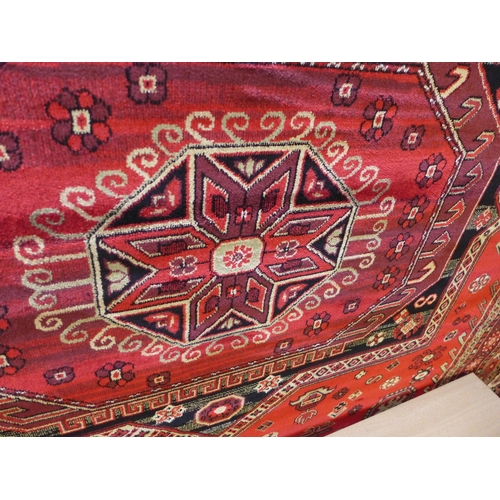 1582 - A rich red ground full pile Cashmere carpet with Beluchi design, 200cm x 300cm