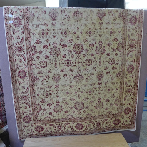 1587 - A red and cream ground Cashmere with all-over floral pattern (230cm x 160cm)