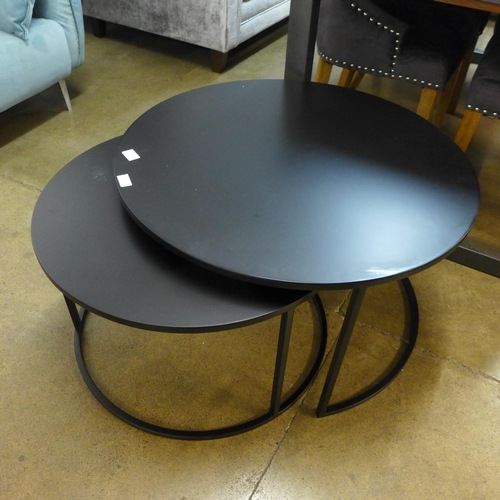 1322 - A black metal circular nest of tables