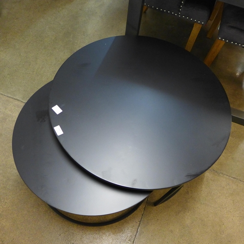 1322 - A black metal circular nest of tables