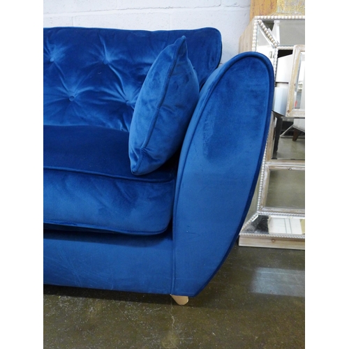 1417 - A blue velvet Hoxton three seater sofa