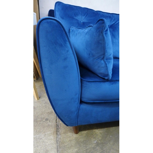 1418 - A blue velvet Hoxton three seater sofa