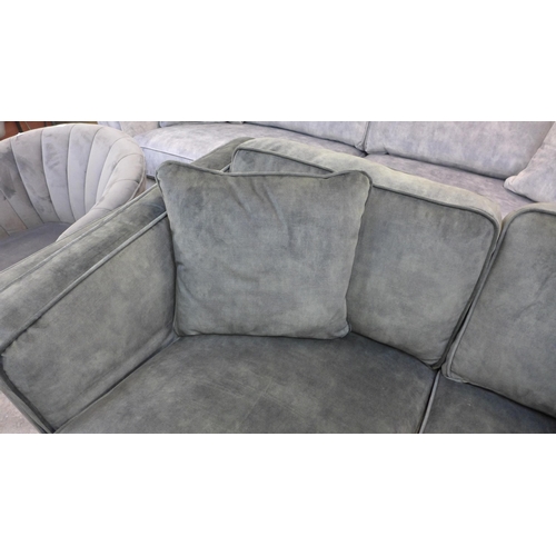 1438 - A Barker and Stonehouse green velvet two seater sofa - RRP £1295