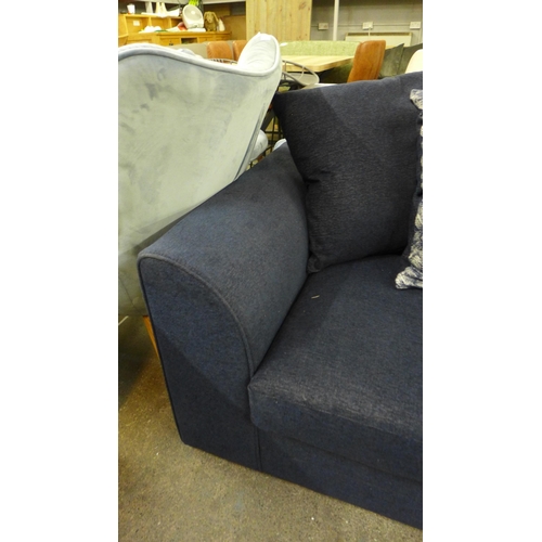 1494 - A blue velvet three seater sofa