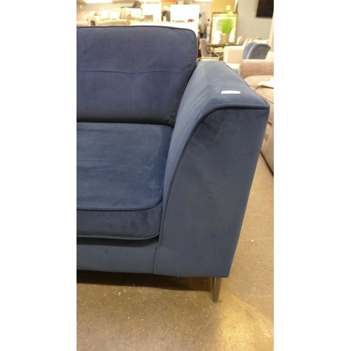 1495 - A blue velvet three seater sofa