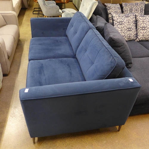 1495 - A blue velvet three seater sofa