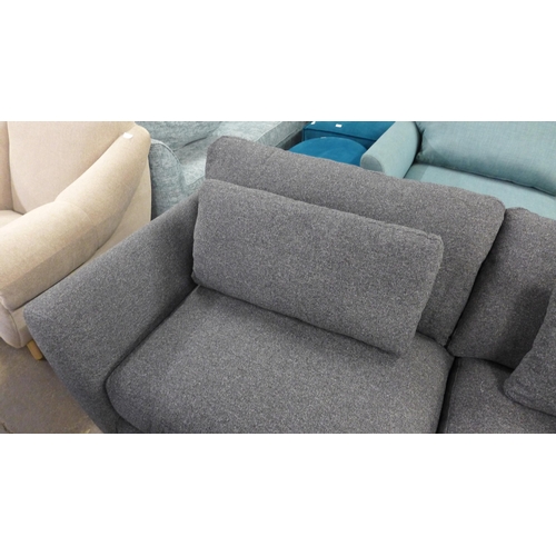 1506 - A grey upholstered three seater sofa