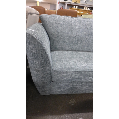 1508 - An aquamarine flecked three seater sofa - RRP £1099