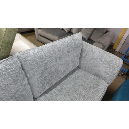 1508 - An aquamarine flecked three seater sofa - RRP £1099