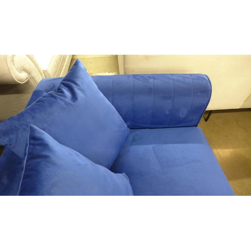 1512 - A blue velvet two seater sofa