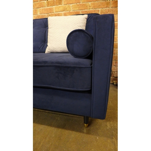 1539 - A blue velvet four seater sofa - RRP £1589