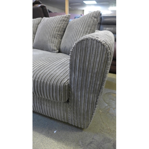 1568 - An ash jumbo cord three seater sofa