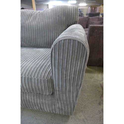 1570 - An ash jumbo cord two seater sofa