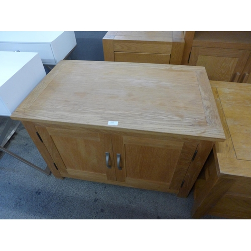 1643 - An oak TV stand, coffee table, bookcase and two drawer bedside chest