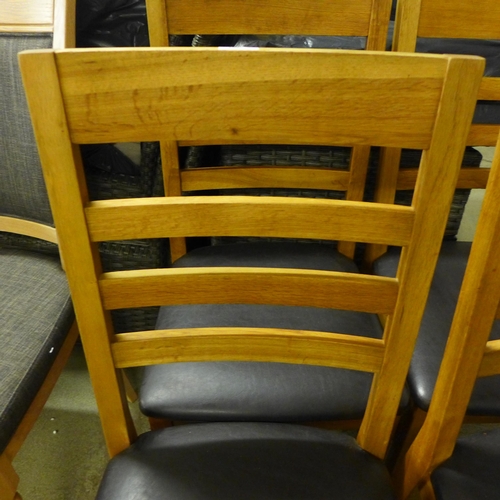 1646 - A set of four oak dining chairs