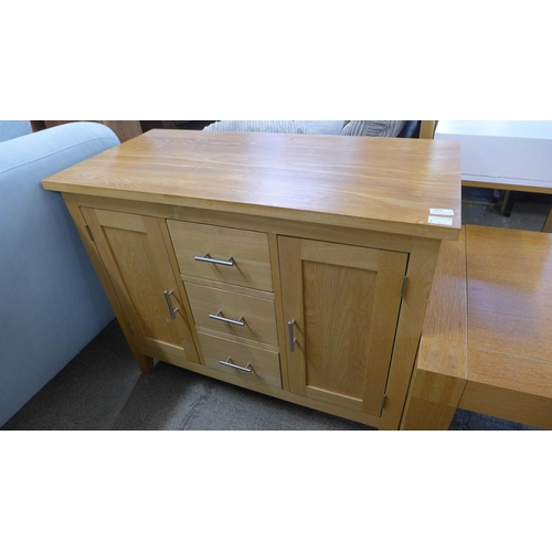 1655 - A two door, three drawer oak sideboard and lamp table