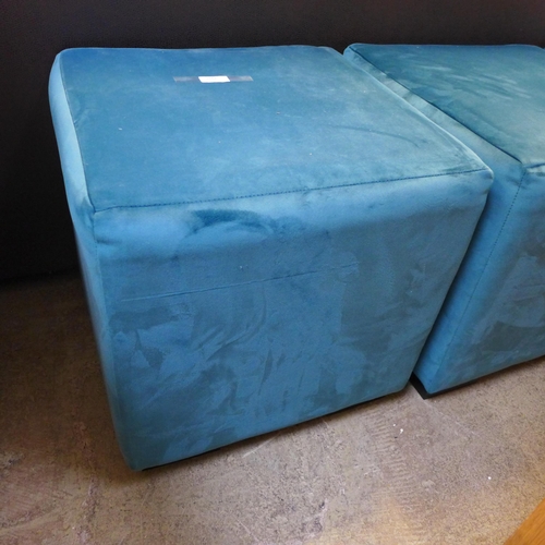 1662 - A set of three teal velvet cube footstools