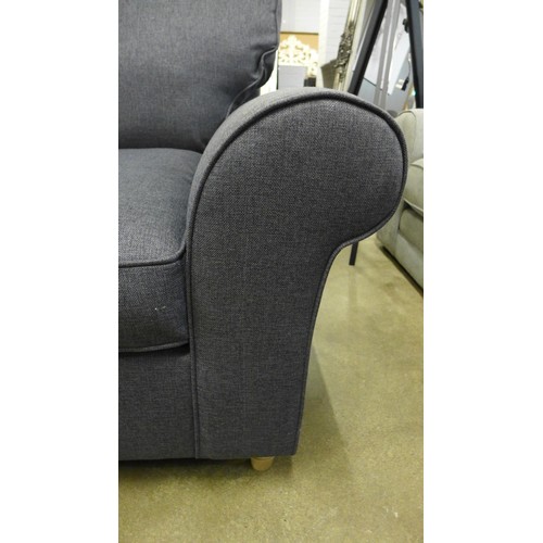 1394 - A charcoal upholstered armchair