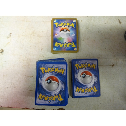 2213 - Pokemon cards and smurf figures