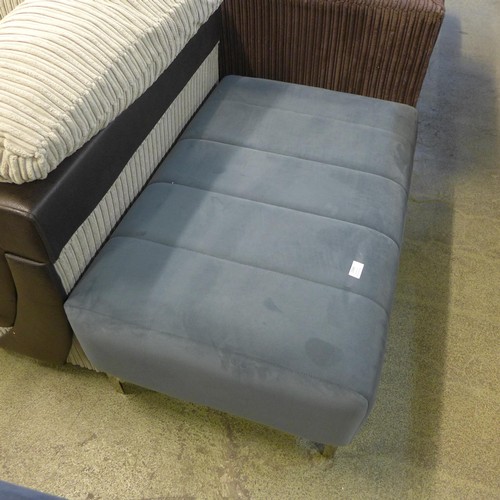 1564 - A blue/grey velvet upholstered footstool on chrome legs