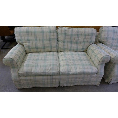 1638 - An off white and green plaid three seater sofa and armchair