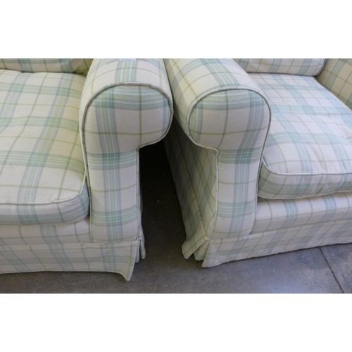 1638 - An off white and green plaid three seater sofa and armchair