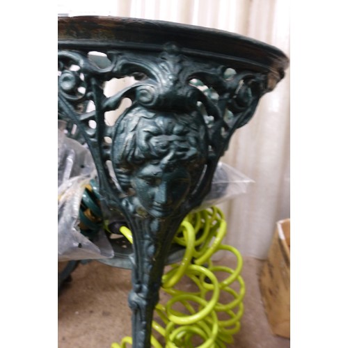 2357 - Ornate wrought iron table base and 2 garden hoses