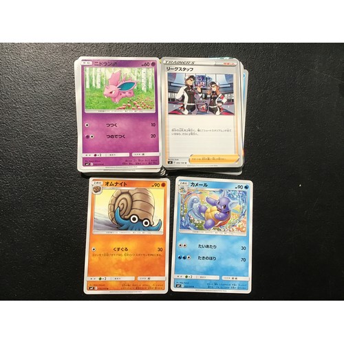 2213 - Pokemon cards and smurf figures