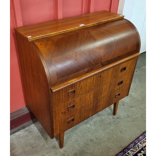 21 - A Swedish S.M.I. teak cylinder bureau, designed by Egon Ostergaard