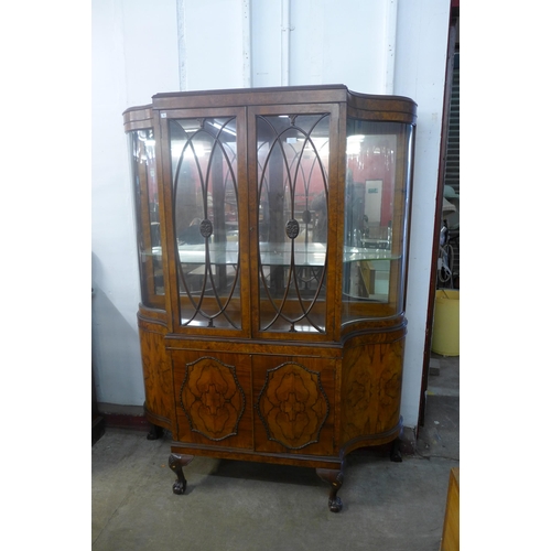 225 - A Queen Anne style figured walnut serpentine side cabinet