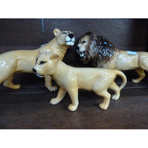 659 - A Beswick lion, lioness and cub ceramic figures