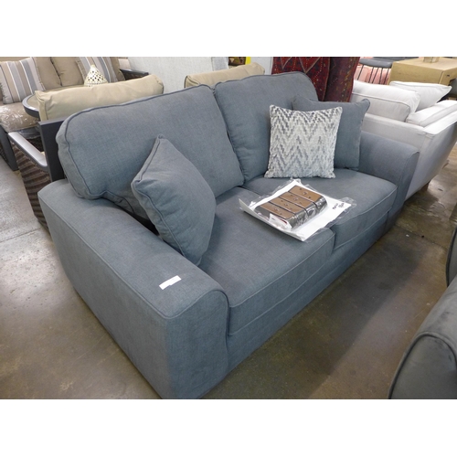 1309 - A grey upholstered three seater sofa