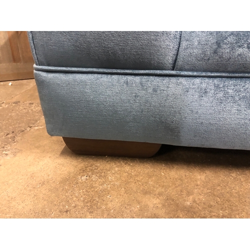 1315 - A steel blue upholstered three seater sofa