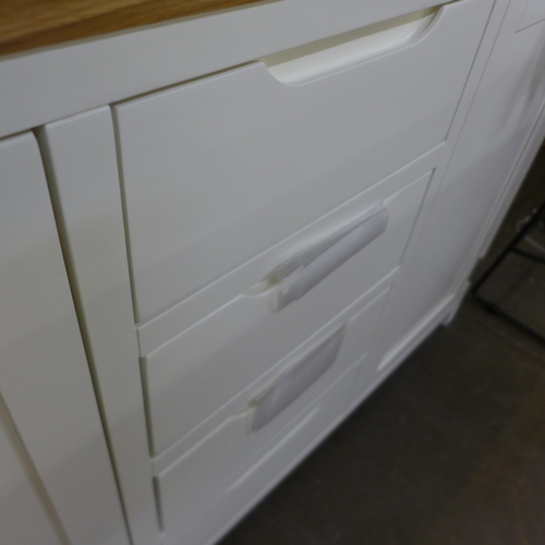 1335 - A Hove white painted and oak two door, four drawer sideboard, slight mark to the back right hand cor... 