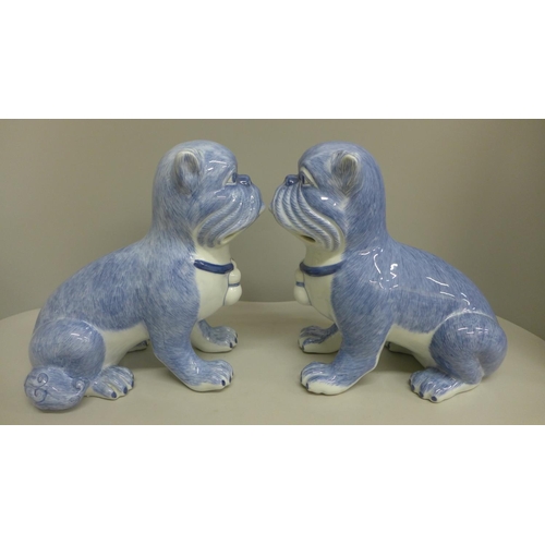 602 - A pair of pottery pugs