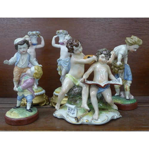 616 - A pair of continental figural candlesticks, one a/f, a Neapolitan cherub figure group and a pair of ... 