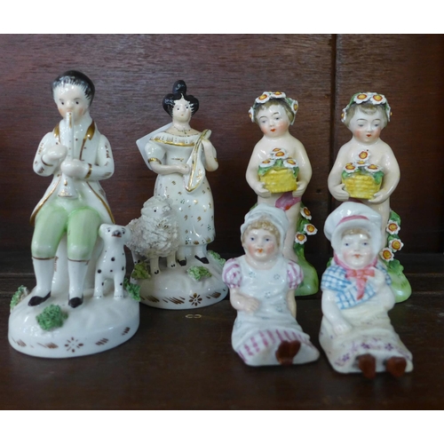 623 - Two pairs of 19th Century figures and two single Staffordshire figures, one pair with head garland o... 