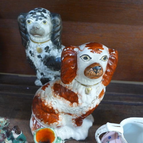 680 - A collection of Staffordshire pottery; two Spaniels, two spill holders, one a/f, early 19th Century ... 