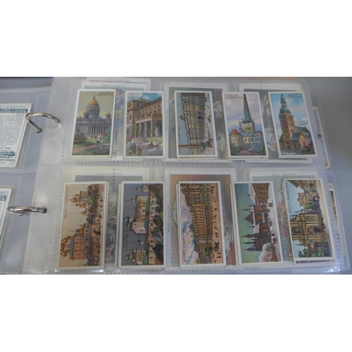 693 - Cigarette cards; two albums of cards in full sets