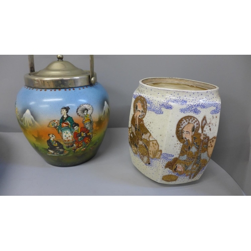 697 - An Imari charger and two biscuit barrels, one lacking lid