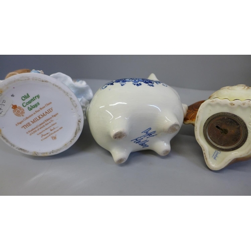 703 - A Royal Worcester figure, Delft piggy bank, Goebel money box and decorative lidded jar