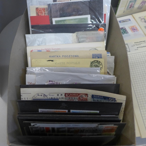 710 - Stamps; a box of stamps, covers, etc., in five albums and stock cards