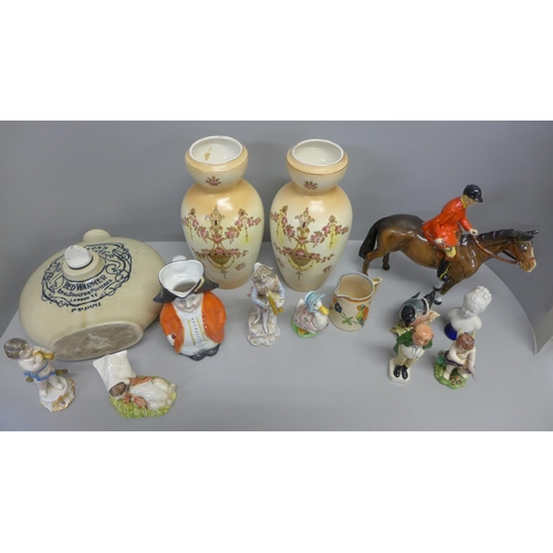 770 - A collection of figures and a pair of Crown Devon vases and a Royal Doulton hot water bottle