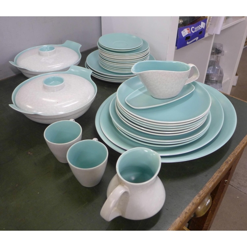 783 - A Poole dinner set including two tureens, two large serving plates, thirteen plates, a gravy jug, tw... 