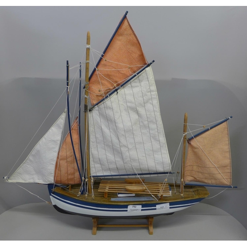 792 - A wooden model of a sailing boat