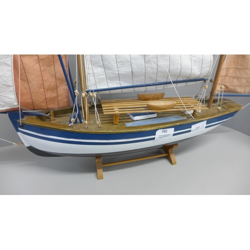 792 - A wooden model of a sailing boat