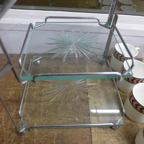 799 - An Art Deco two-tier chrome and glass cake stand and seven Arnolfi di Cambio coffee cups and saucers