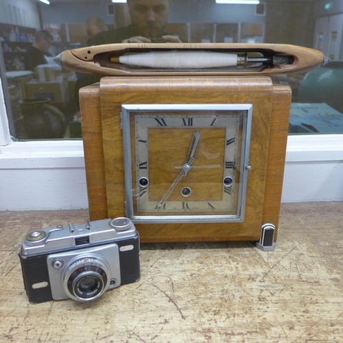 801 - A wooden mantel clock, spinning shuttle and camera