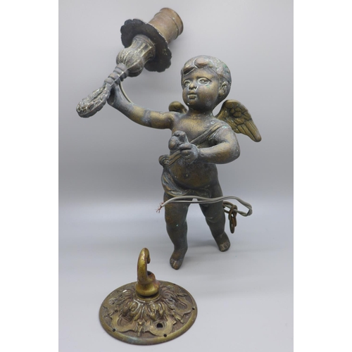 803 - A cherub brass ceiling light with hook